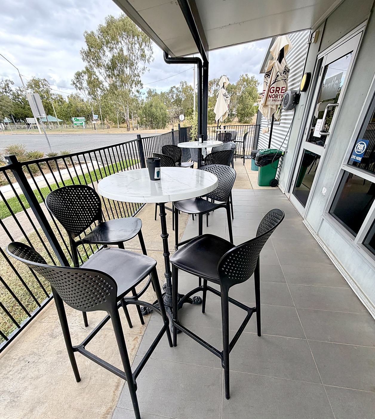 Verandah tables looking out over the grounds
