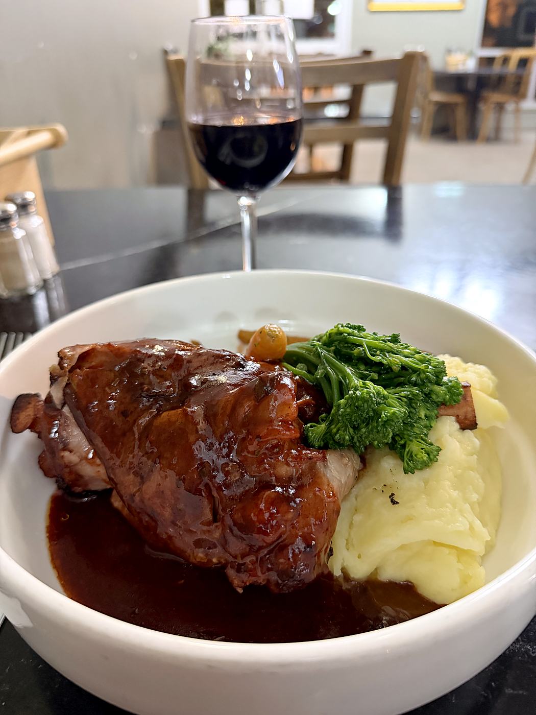 Lamb shank with mash and greens