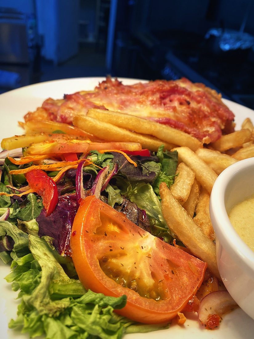 Chicken parmigiana with chips and salad